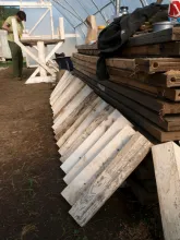 Assembling "topper" conventional straight legs, using a completed pedestal table as a work surface.