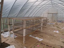 "Toppers" have conventional legs, and are intended for supporting lightweight material like bird netting or greenhouse plastic.