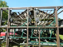 Side view showing a bine being stripped (harvested).